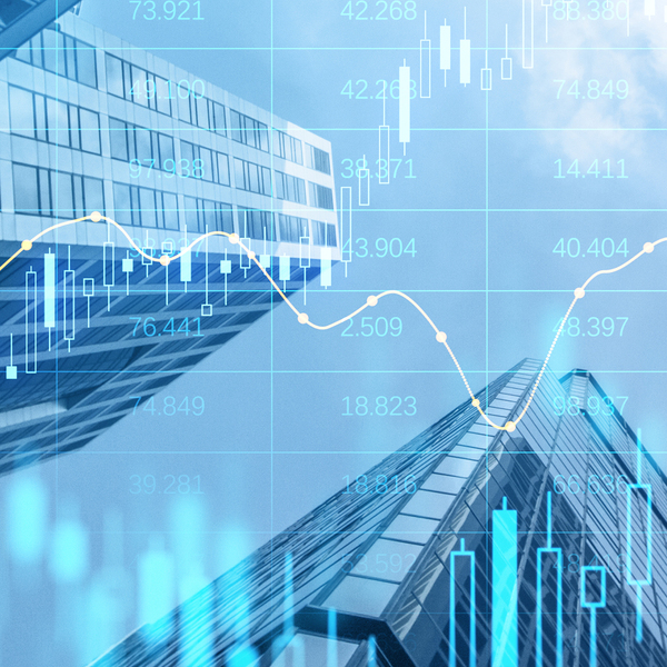 Creative glowing big data forex candlestick chart on blurry city background