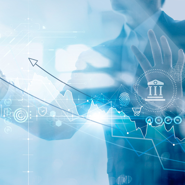Businessman holding structure graph chart of business investment