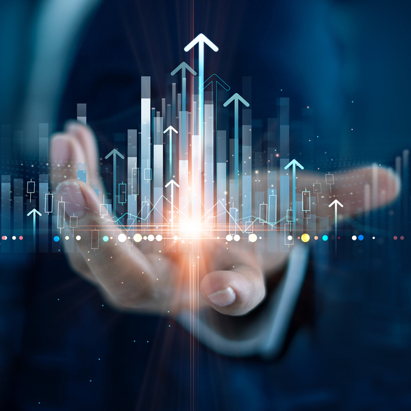 Businessman holding structure graph chart of business investment